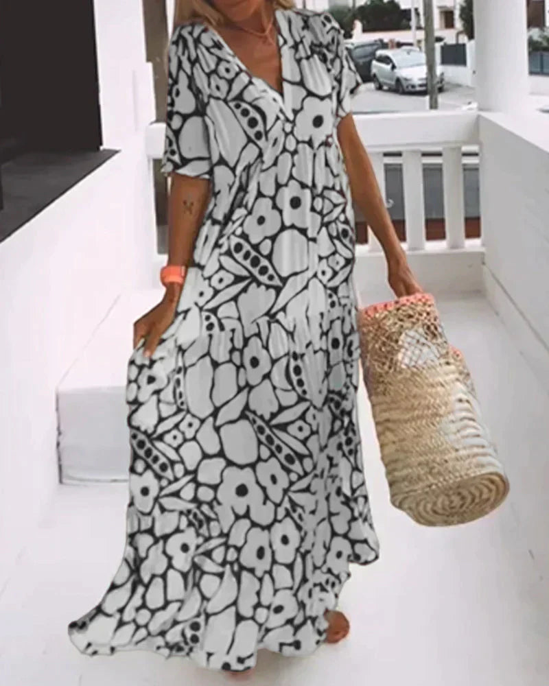 Nuria - Vestido largo de verano de corte vaporoso y elegante estampado gráfico
